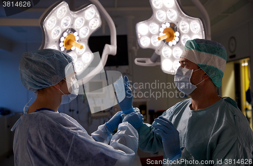 Image of surgeons in operating room at hospital