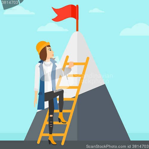 Image of Woman climbing on mountain.