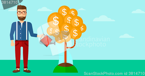Image of Man watering money tree.