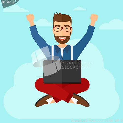 Image of Man sitting on cloud with laptop.