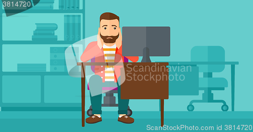 Image of Tired employee sitting in office.