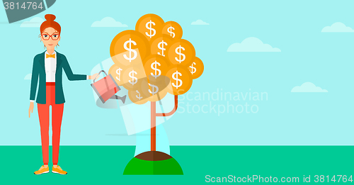 Image of Woman watering money tree.