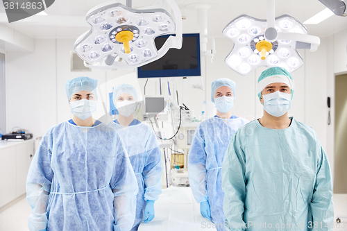 Image of group of surgeons in operating room at hospital