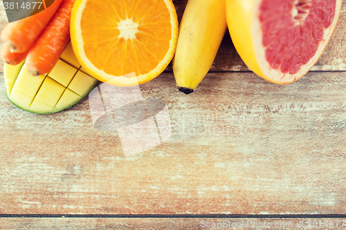 Image of close up of fresh juicy fruits on table