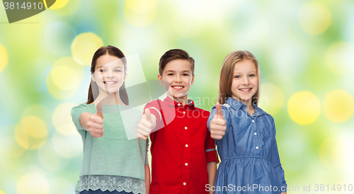 Image of happy children showing thumbs up