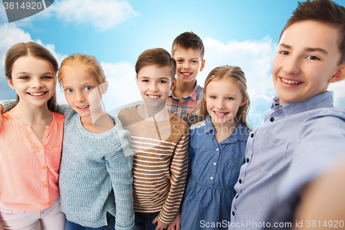 Image of happy children talking selfie