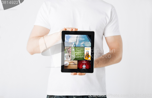 Image of close up of man with tablet pc and web pages