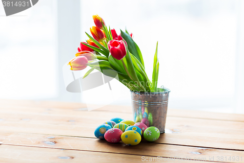 Image of close up of easter eggs and flowers in bucket