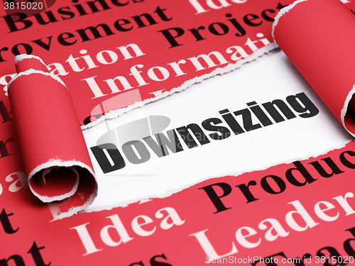 Image of Business concept: black text Downsizing under the piece of  torn paper