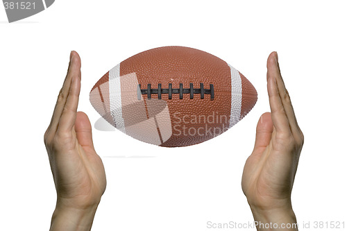 Image of Football between two hands