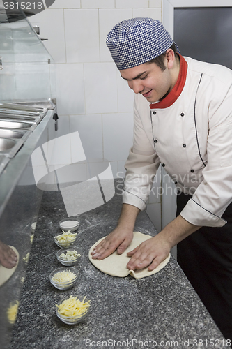 Image of Chef Cooking Pizza