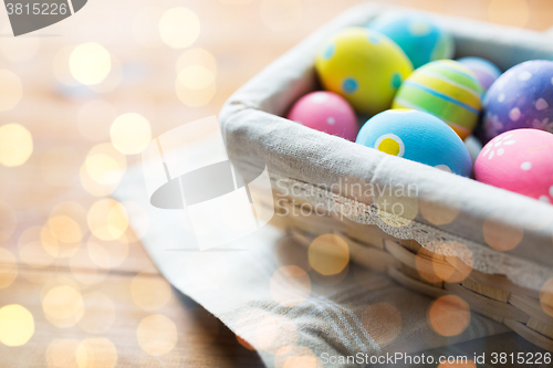 Image of close up of colored easter eggs in basket