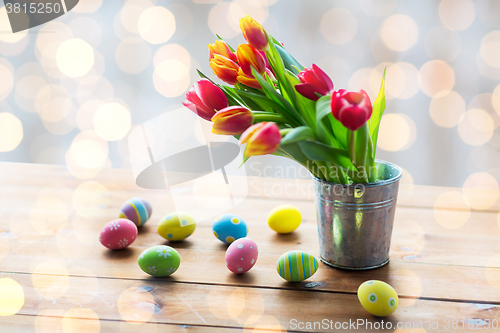 Image of close up of easter eggs and flowers in bucket