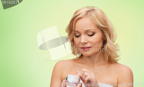 Image of middle aged woman with cream jar