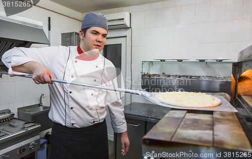 Image of Chef Cooking Pizza