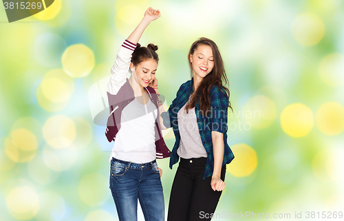 Image of happy smiling pretty teenage girls dancing