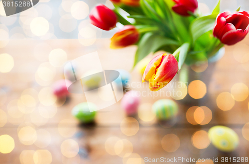 Image of close up of easter eggs and flowers in bucket