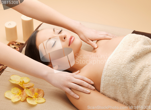 Image of beautiful woman in massage salon