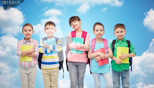 Image of happy children with school bags and notebooks