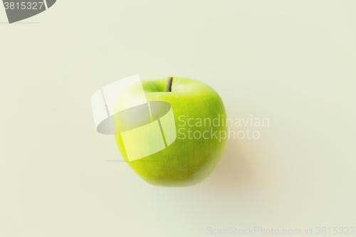 Image of ripe green apple over white