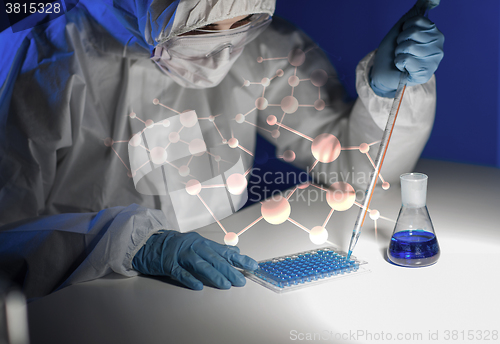 Image of close up of scientist making test in lab