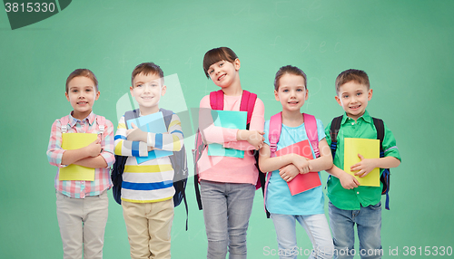 Image of happy children with school bags and notebooks