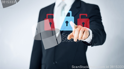 Image of close up of man pointing finger to lock icon