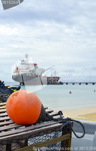 Image of oil tanker ship at dock with lobster pot trap and buoy  Picnic C