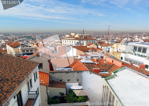 Image of    panorama metropolitan Madrid Spain Europe with red tile roof condos offices and Cathedral    