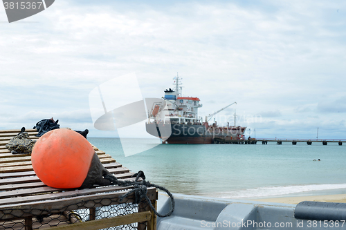 Image of oil tanker ship at dock with lobster pot trap and buoy  Picnic C