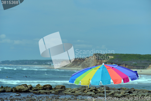Image of colorful umbrella Ditch Plains surf beach Montauk, Long Island, 
