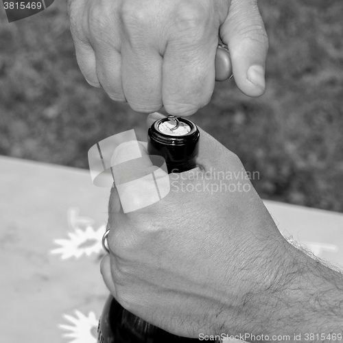 Image of Black and white Bottle opening