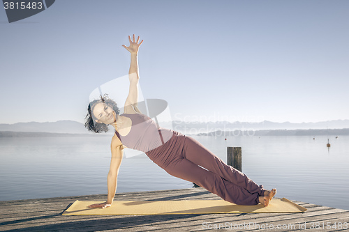 Image of yoga woman at the lake