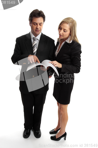 Image of Business people reading contract or report