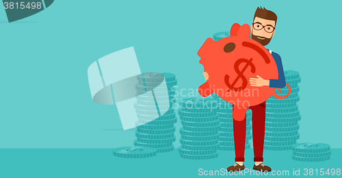 Image of Man carrying piggy bank.