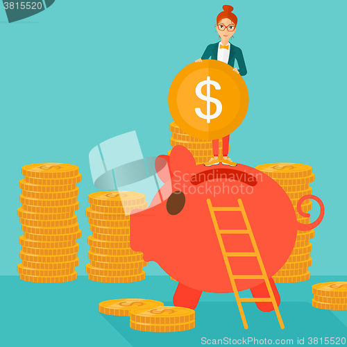 Image of Woman putting coin in piggy bank.