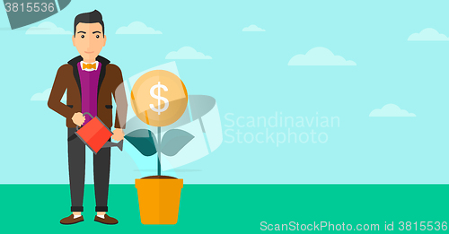 Image of Man watering money flower.