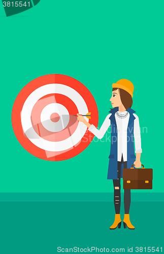 Image of Business woman with target board.