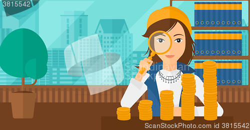 Image of Woman with magnifier and golden coins. 