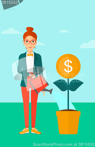 Image of Woman watering money flower.