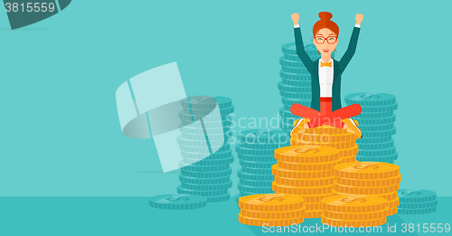 Image of  Happy business woman sitting on coins.