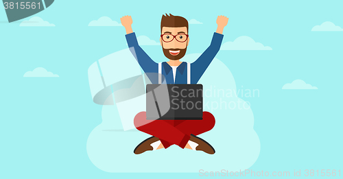 Image of Man sitting on cloud with laptop.