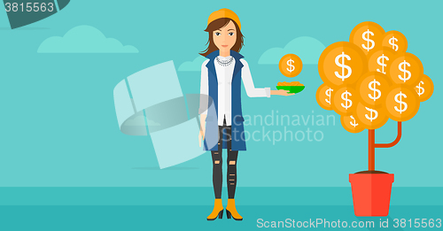 Image of Woman catching dollar coins.