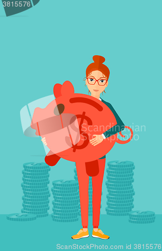 Image of Woman carrying piggy bank.