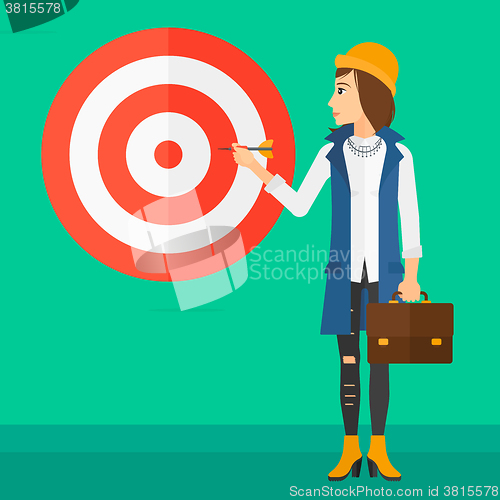 Image of Business woman with target board.