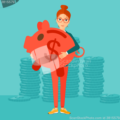 Image of Woman carrying piggy bank.
