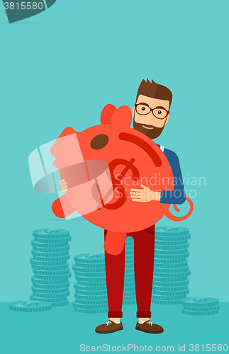 Image of Man carrying piggy bank.