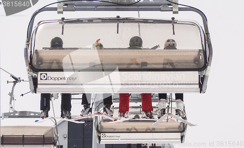 Image of A view of people sitting on the cableway 