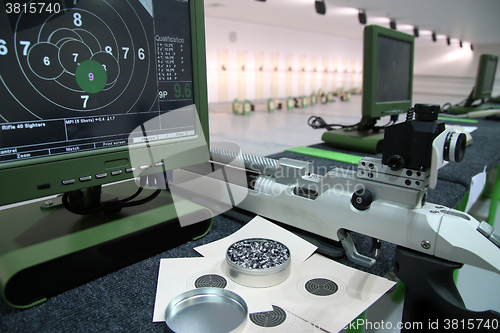 Image of air rifle and 10m target monitor