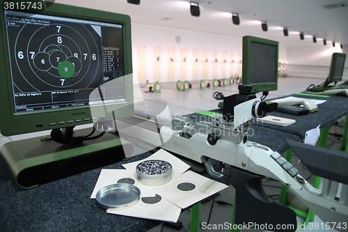 Image of air rifle and 10m target monitor